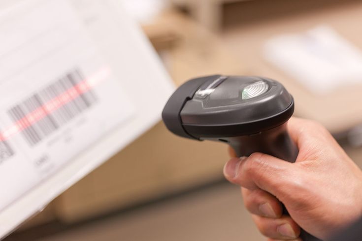 Barcode scanner reading a medication label